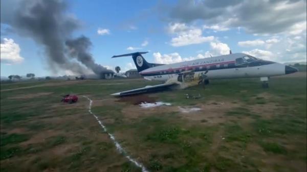 Two planes off runway, one smoking